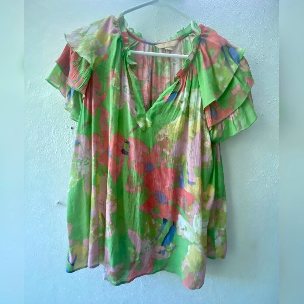 Floral blouse in green and pink.